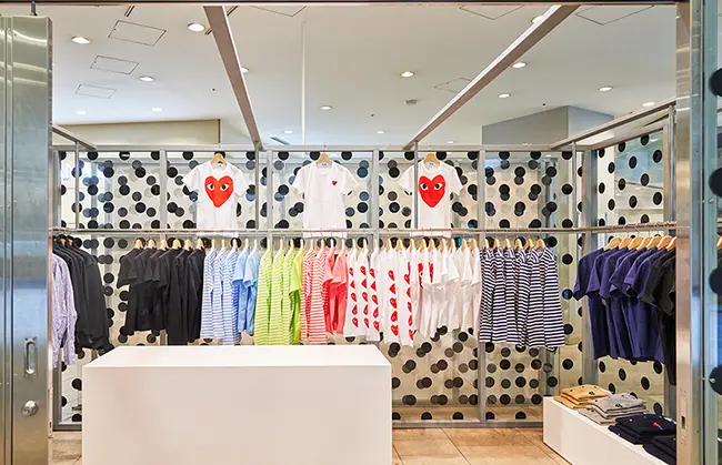 Comme des Garcons PLAY heart logo cardigan display Namba Parks